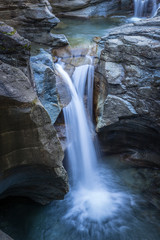 Long exposure of Gavagliasch water fall of imposing Cavagliasco gorge close to giants’ pots site in Val Poschiavo