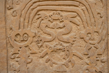 Ancient pre-Columbian symbols of the South American Chimu culture in their capital Chan Chan in Peru