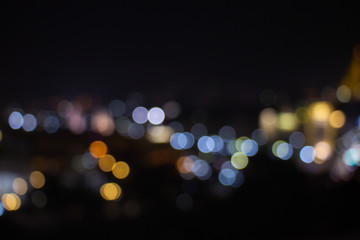 Night twilight blurred light bokeh in downtown bangkok abstract background.