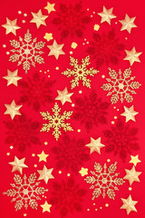 Obraz na płótnie Canvas Christmas red & gold star & snowflake bauble decorations on red background. Traditional symbols for the festive season and New Year. 