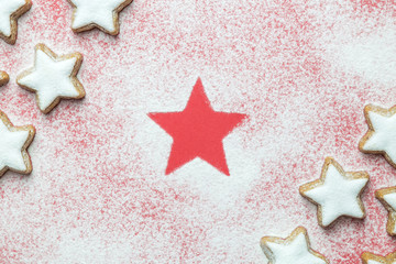 Top view of christmas holiday star biscuits covered with sugar powder.