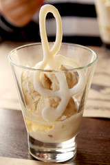 Ice cream in a glass with a chocolate treble clef close-up