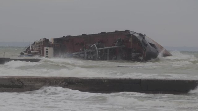 Odessa, Ukraine 11.22.2019: The wreck of the tanker "Delfi" on the Odessa beach. Ecological disaster - oil spill on city beaches as a result of a shipwreck.