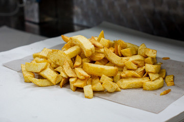 Fish and chip shop, Chips on paper ready to be servered