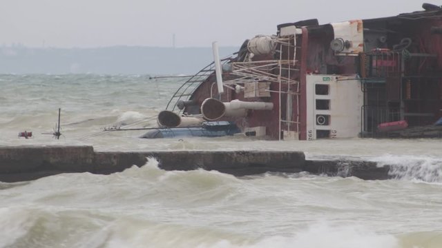 Odessa, Ukraine 11.22.2019: The wreck of the tanker "Delfi" on the Odessa beach. Ecological disaster - oil spill on city beaches as a result of a shipwreck.