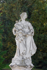 Old statue and colorful autumn colors in the park
