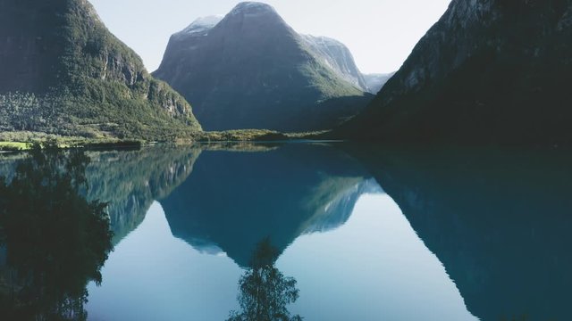 Lovatnet lake and mountains in Norway aerial view turquoise water mirror reflection landscape travel idyllic scenery beautiful destinations	