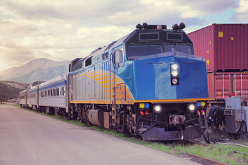 Fototapeta na wymiar Passenger train stands on Jasper station. Canada.