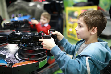Kid playing toy machine gun