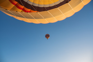 Fototapeta premium View from hot air balloon on another balloon during flight. Cappadocia, Turkey.