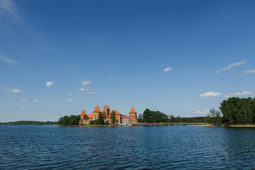 Fototapeta na wymiar Old Trakai castle in sunny day. Trakai, Lithuania, Galve lake.
