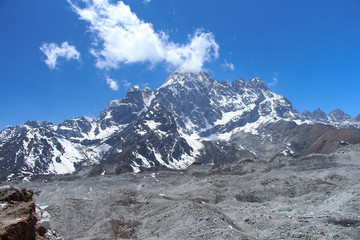 Pharilapche mountain (6017 meters) rises above Ngozumpa glacier covered with stones in Sagarmatha national park in Himalayas. Route to Everest base camp through Gokyo lakes.