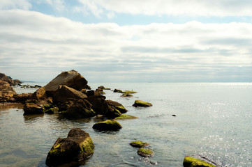 Sea landscape. Evening on the stone beach. Beautiful landscape. Vocation concept. Panoramic view.