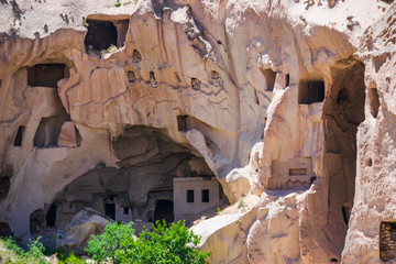Ancient volcanic stones with caves and holes, Cappadocia, Turkey.