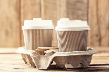Fototapeta na wymiar Coffee or tea in a paper cup with a lid