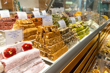 Eastern desserts displayed on sweets shelves for sale