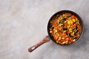 Stewed vegetables in a pan.