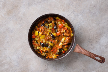 Stewed vegetables in a pan.