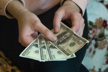 the girl holds a mobile phone in her hands