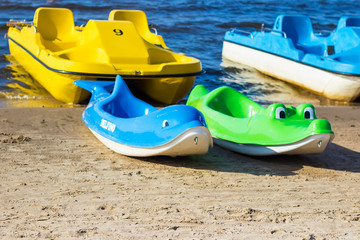 Boats, catamaran, surfing, paddles and other sail equipment on the shore of the Gulf of Riga of the Baltic Sea. Coastal landscape, Dzintari, Jurmala, Latvia