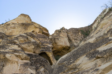 Ancient volcanic stones with caves and holes, Cappadocia, Turkey.