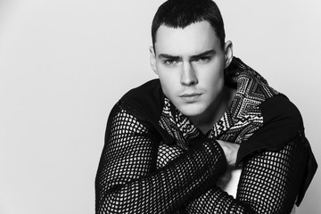 Obraz premium Muscle strong beautiful stripped male model portrait on isolated font background with shadow