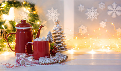 Vintage Christmas background. Christmas cup of coffee or tea on blurred, sparkling and fairy...