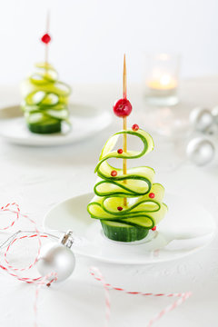 Naklejki Cucumber Christmas tree, funny food for kids. Christmas food background.
