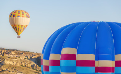 Close up shot of hot air balloon during flight in Cappadocia valleys.