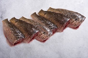 fresh peeled carp on ice