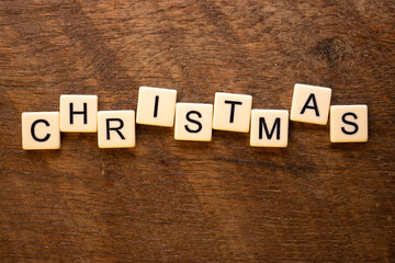 the word Christmas on wood