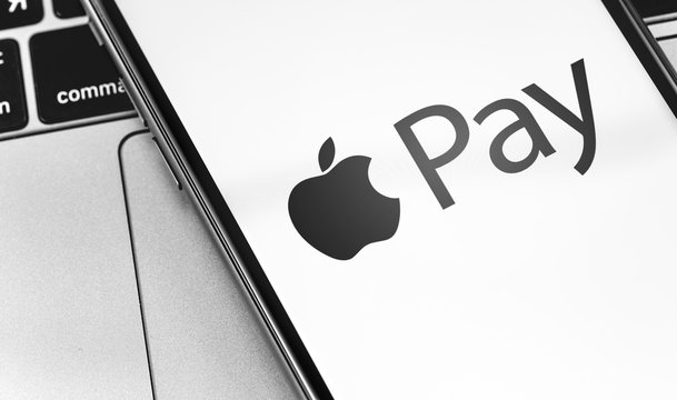 iPhone with Apple Pay symbol on the screen closeup. Apple Pay is a mobile payment and digital wallet service by Apple Inc. Moscow, Russia - March 17, 2019