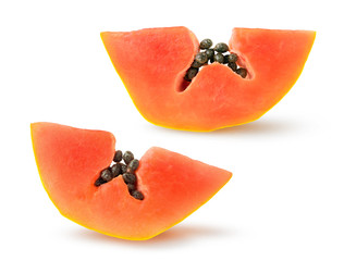 Isolated papaya. Two pieces of papaya fruit with seeds isolated on white background with clipping...