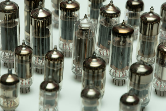 different vintage vacuum lamps for electronic amplifiers, audio players and tube TVs on a white background