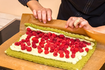 Cooking dessert of fresh raspberries. Pistachio pie