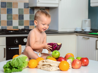 Cute baby eat cabbage. Healthy nutrition for children. Fresh vegetables and fruits.