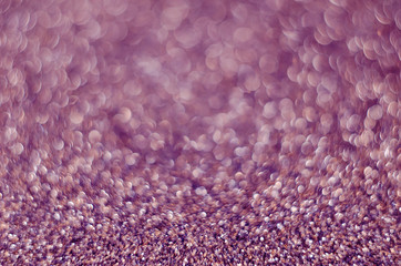 Abstract festive pink bokeh background with shining defocus sparkles. Blurred glitters shimmering dust macro close up, copy space for text logo
