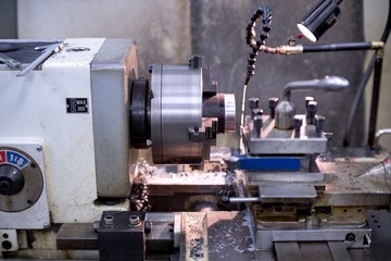 Old metal lathe machine, retro machine background.