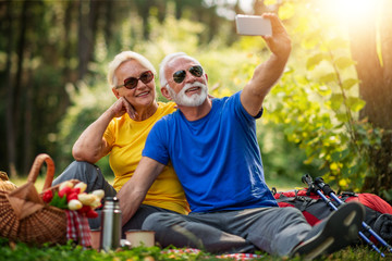 Senior couple enjoying in a good mood in the park