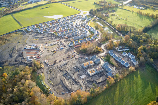 Large Housing Development Aerial View In Construction On Rural Countryside Site Scotland UK