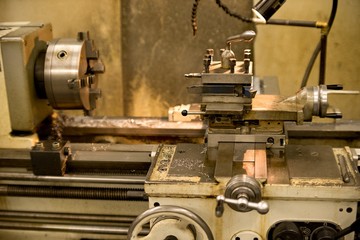Old metal lathe machine, retro machine background.