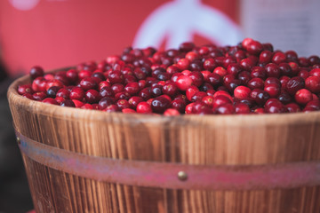 fresh cranberries in a wooden barrel