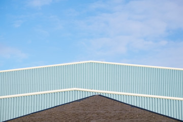 Industrial unit roof corrugated metal straight design against blue sky