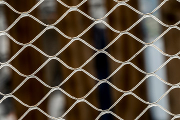Fototapeta premium strong net or fence of border to stop illegal migrants in the middle of desert 