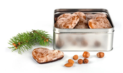 Gingerbread nuts in metal  box on white background