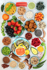 Healthy super food collection with foods high in antioxidants, vitamins, minerals, protein, smart carbs, omega 3 and fibre.  Good health concept. Flat lay, top view.