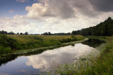 Fototapeta na wymiar The Forth and Clyde canal in Scotland on a summer day.