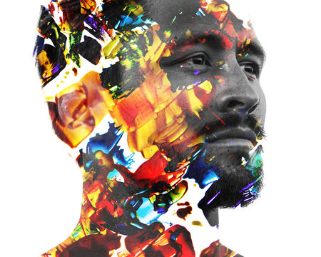 Paintography. Double exposure profile portrait of an attractive male model combined with hand drawn colorful painting with texture and brightness