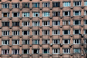 Fototapeta na wymiar Windows of an apartment building where every tenant has his own privacy