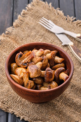 Clay plate with roasted mushrooms